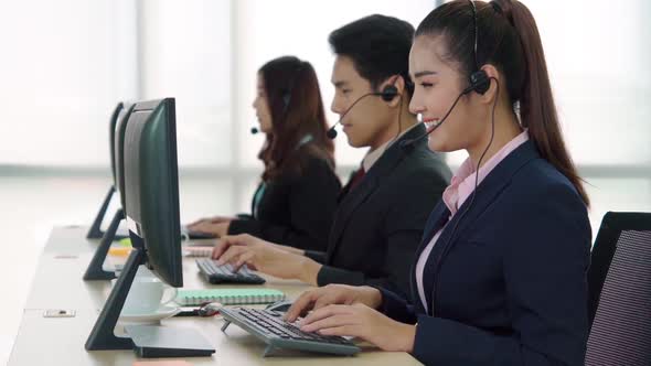 Business People Wearing Headset Working in Office