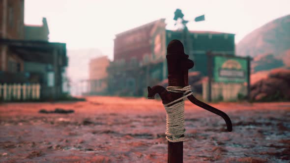 Old Rusted Water Pump in Wild West Town alt