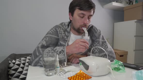 Man Does Inhalation at Home During an Illness Pneumonia Infection with Coronavirus Covid 19