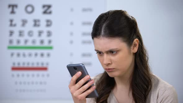 Female Patient Making Appointment on Smartphone, Modern Technologies, Small Font