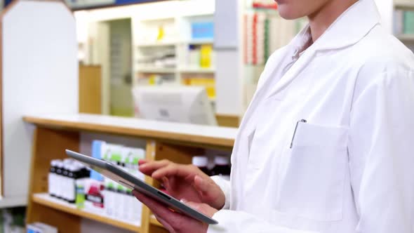 Pharmacist using digital tablet