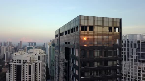 Sun Reflection On Modern Glass Skyscraper In Singapore