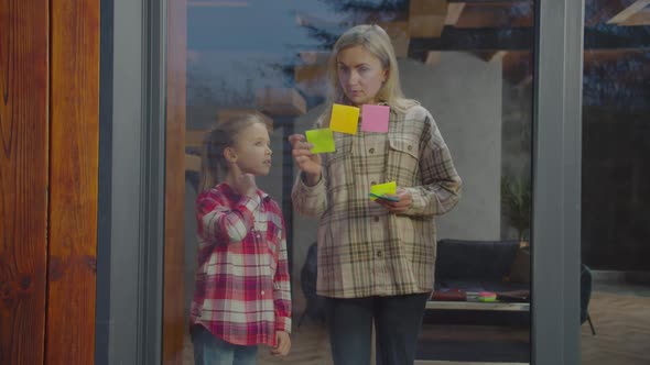 Mom and Daughter Discussing Household Chores Indoors