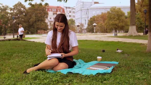 Woman Studying in Park  