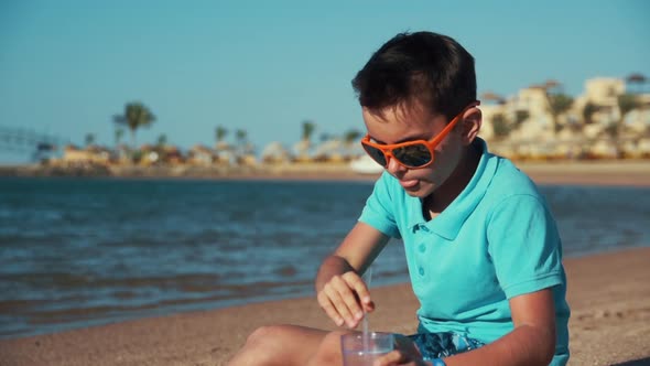 Attractive Teenage Boy Enjoying Beautiful Coastline in Resort Beach.