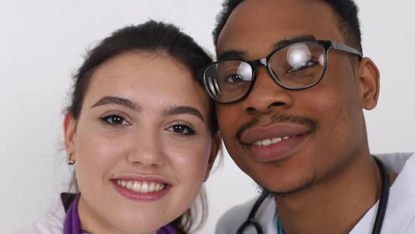 Young African doctor with a European girl of a doctor. Treatment concept.