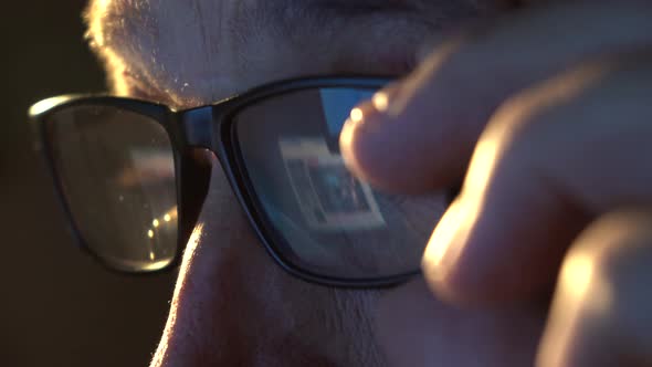 Closeup of the Focused Eyes of a Businessman Wearing Computer Glasses