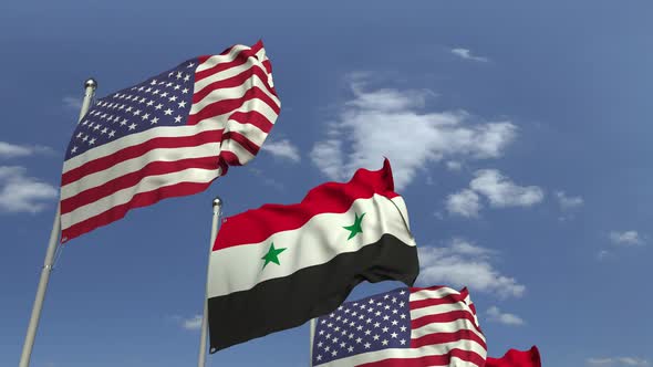 Flags of Syria and the USA Against Blue Sky