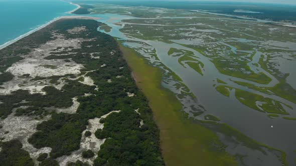 drone shots of the sand dunes and marsh lands at the coast