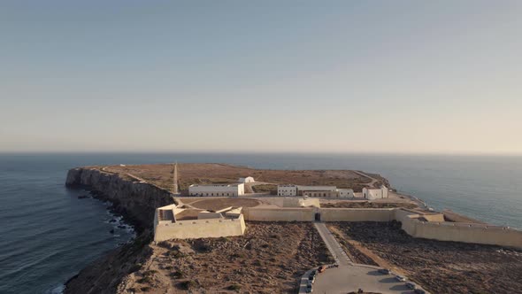 Drone flying in low altitude away from the defensive wall of Sagres fortress, Portugal