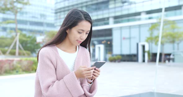 Woman use of mobile phone at outdoor