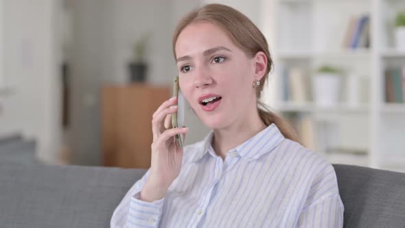 Portrait of Cheerful Young Woman Talking on Smartphone