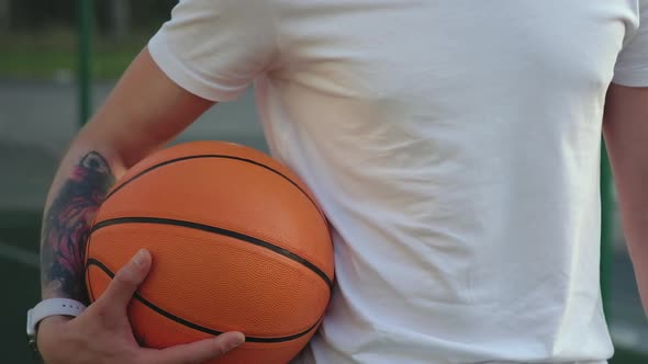 Basketball Player Holding a Ball