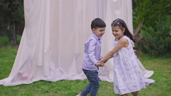 Wide Shot of Cheerful Middle Eastern Children Having Fun at Wedding Altar on Marriage Ceremony