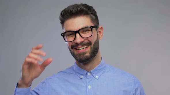 Portrait of Happy Smiling Young Man in Glasses