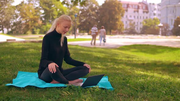 Blonde Girl Chatting Online Outdoors