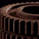 Rotation of a Metal Gear on a Black Background Closeup - VideoHive Item for Sale
