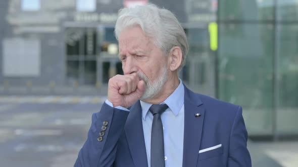 Outdoor Coughing Old Businessman