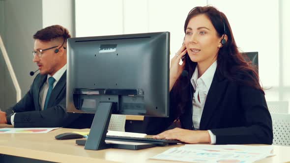 Business People Wearing Headset Working in Office