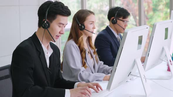 Business People Wearing Headset Working in Office