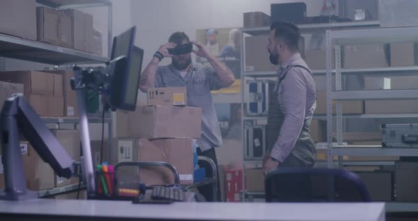 Workers in Distribution Center Playing with VR Headset