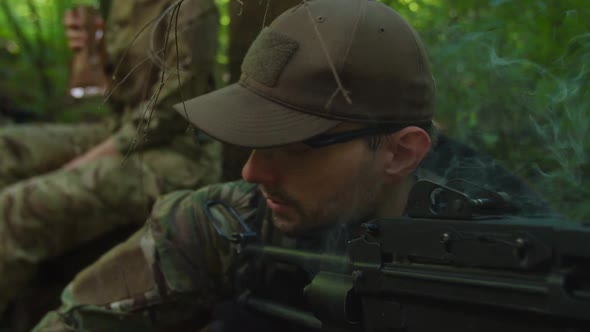 Portrait Military Watcher with Machine Gun Smoking Covering Soldiers