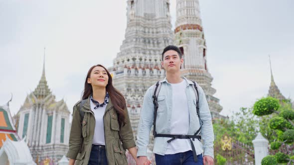 Asian attractive romantic couple travel in the city for honeymoon trip.