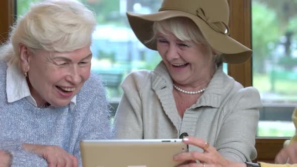 Women with Tablet Laughing.