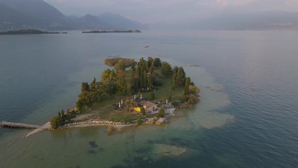 Aerial view of tiny bar on San Biagio Island on lake Garda, northern Italy