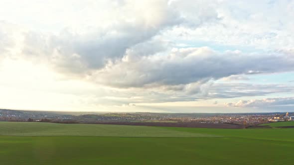 Flying Over an Green Empty Field