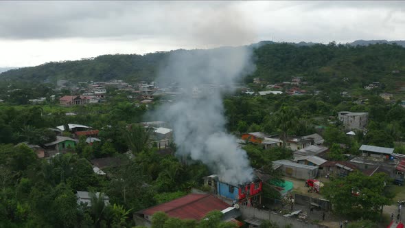 A house on fire, most of the fire has been extinguished