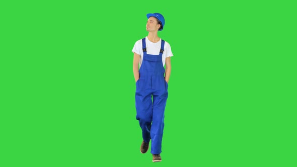 Walking Construction Worker in a Helmet on a Green Screen Chroma Key