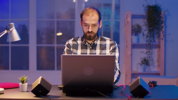 Young Freelancer Yawning While Working Late Night Hours From Home