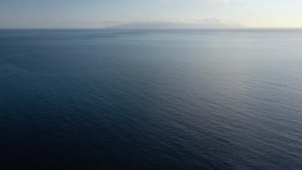 Flying Over the Blue Surface of the Sea or Ocean