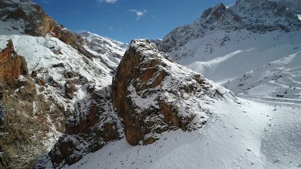 Man Mountaineer At The Top Of A Rock