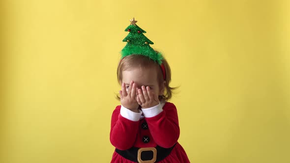 Portrait Emotion Happy Chubby Toddler Baby Girl In Santa Suit