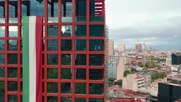Cinematic Close Up Aerial View of Red Modern Glass Building in Mexico City, 