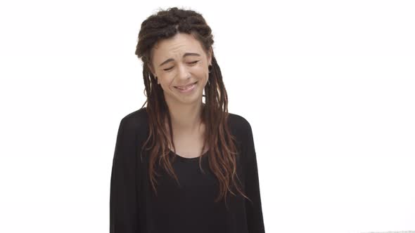 Video of Beautiful Hippie Girl with Dreadlocks and Ear Tunnels Looking Happy at Camera Starting to