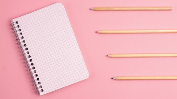 Stop motion animation mockup of white notepad and wooden pencils on pink background