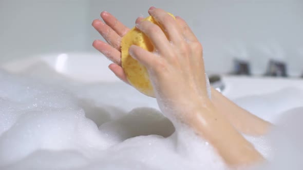 Female in Bath Washing Hands With Sponge, Daily Beauty Procedure, Skin Care