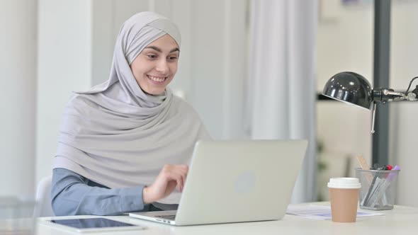 Young Arab Woman Talking on Video Call on Laptop