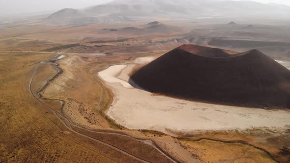 Space Ship Flying Towards a Volcanic Canyon on Mars