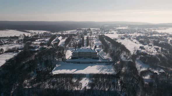 Aerial View Drone Flight Forward Over the Historic Old Castle at Sunny Winter Day Pidhirtsi Palace