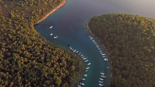 Aerial view of boats anchored at the shore of Krivica, Croatia.