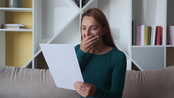 Sad Woman Sitting on Couch at Home Reads Received Bad News 