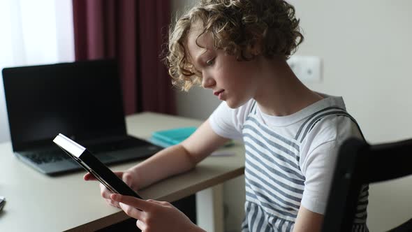 Closeup Tracking Shot of Sad Little 10s Girl Holding Photo in Frame in Hands and Looking Sorrowfully