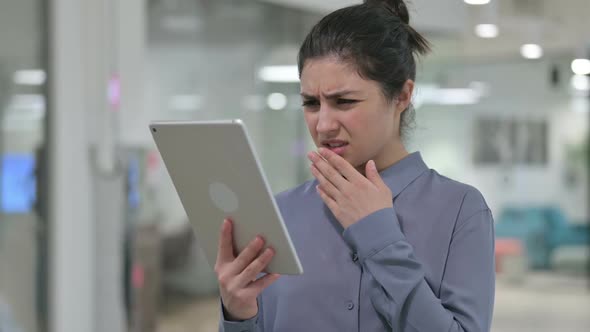 Portrait of Indian Woman Reacting to Loss on Tablet