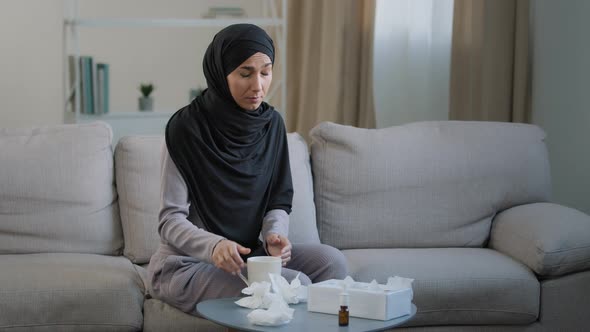 Sick Arabian Muslim Young Unhealthy Woman in Hijab Suffer From Runny Nose Flu Disease Seasonal