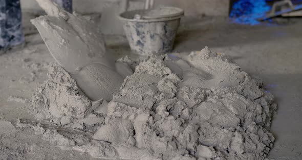 Worker Use Tools To Mix Cement