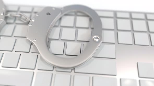 Handcuffs on Keyboard with SPAM Text on Keys